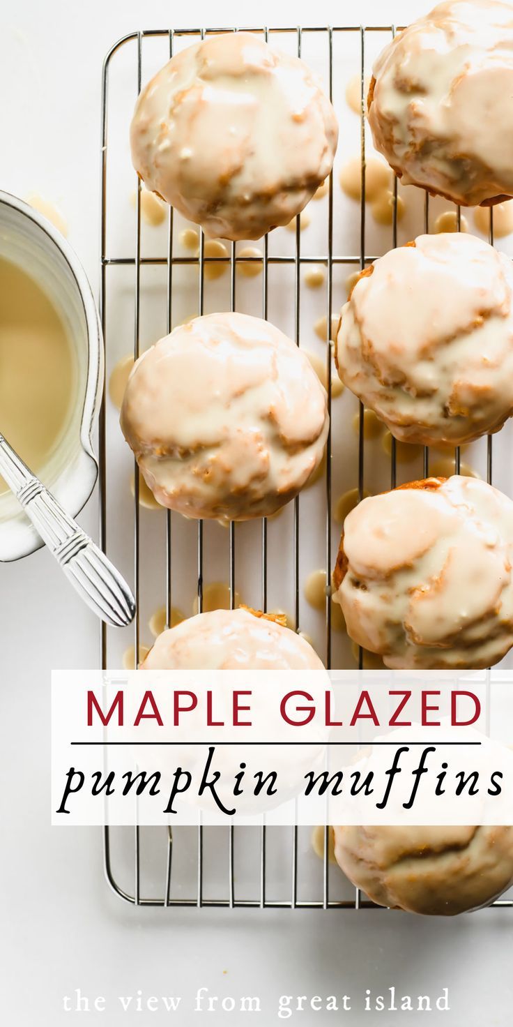 maple glazed pumpkin muffins on a cooling rack with a cup of tea