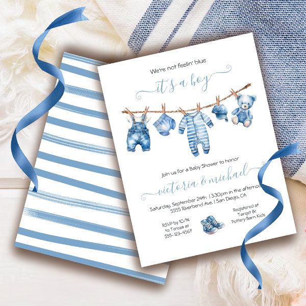 a baby shower is set up with blue and white striped items on the clothesline