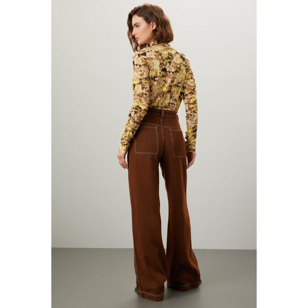 Brown cotton (55% Polyester, 45% VIscose). Pants. Front zipper fly with button closure. 32" inseam. 10" rise. Imported. Stretch Pants With Five Pockets For Fall, Fall Stretch Pants With Five Pockets, Retro High-waisted Pants For Fall, Stretch Bottoms With Button Zip Fly For Fall, Fall Retro High-waisted Pants, Fall Workwear Bottoms With Button Zip Fly, Retro Workwear Jeans For Fall, Retro Wide Leg Bottoms For Fall, Retro Fall Jeans For Office