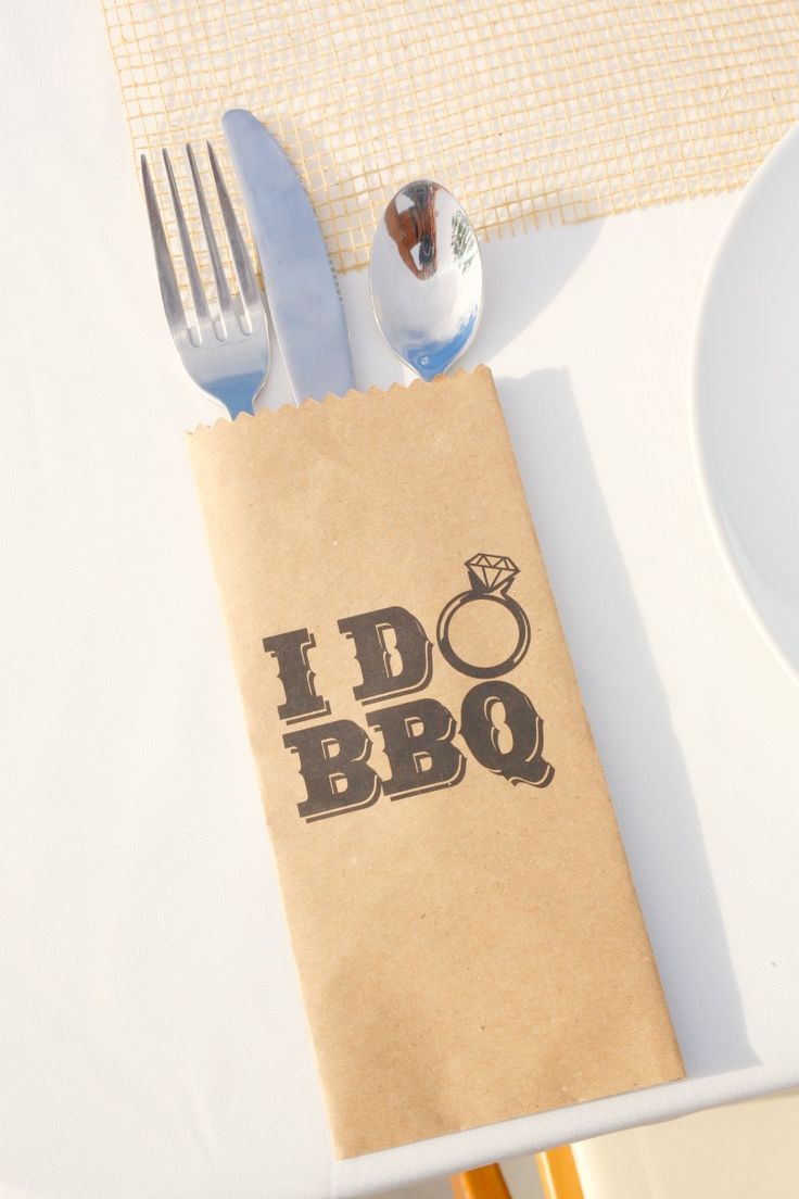 a napkin that says i do bbq on it next to silverware and utensils