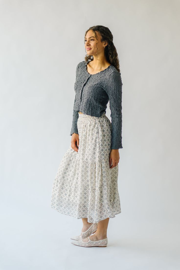 Get ready to twirl in style with the Antosh Tiered Patterned Midi Skirt! This cream-colored skirt features playful tiers and a unique pattern for a fun and quirky look. Perfect for adding personality to any outfit, this skirt will have you feeling confident and stylish. Details self/lining: 100% polyester Fabric Care Guide Here Sizing & Fit Measurements are approximate and taken while laying flat across the front. Not doubled. small: waist = 14"; length = 33" medium: waist = 15"; length = 33" la Casual Maxi Skirt With Layered Hem, Flowy Tiered Gathered Skirt, Casual Flowy Maxi Skirt With Layered Hem, Casual Relaxed Maxi Skirt With Layered Hem, Casual Flowy Skirt With Ruffle Hem, Flowy Casual Skirt With Ruffle Hem, Casual Flared Skirt Bottoms With Layered Hem, Casual Long Skirt With Layered Hem, Flowy Tiered Skirt With Layered Hem