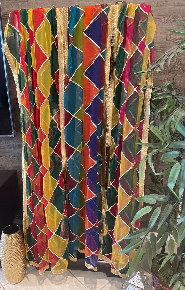 "Beautiful traditional handmade Multi colored net dupatta with Gota Kiran Lace finishing. Perfect for wedding mayoo dholki Mehndi events. Ready to ship in less than 24 hrs. Colors: Option 1: green, yellow, red Option 2: Pink, green, yellow Option 3: Multi (Maroon, orange,green,teal, blue) Size: 90\"x 45\"" Semi-stitched Multicolor Lehenga With Sheer Dupatta, Bohemian Choli With Sheer Dupatta For Festive Season, Multicolor Anarkali Set With Traditional Drape For Eid, Multicolor Anarkali Set For Eid With Traditional Drape, Eid Anarkali Set With Traditional Drape In Multicolor, Bohemian Choli With Sheer Dupatta For Eid, Bohemian Choli With Sheer Dupatta In Chanderi, Bohemian Chanderi Choli With Sheer Dupatta, Bohemian Salwar Kameez With Sheer Dupatta For Navratri