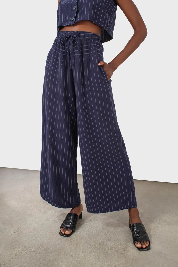 Shop for Navy pinstripe drawstring trousers at Glassworks London. Free UK shipping for orders over £75. Buy Now Pay Later with Klarna. Pinstripe Wide-leg Bottoms With Relaxed Fit, Pinstripe Wide Leg Bottoms With Relaxed Fit, Pinstripe Wide Leg Pants With Relaxed Fit, Spring Linen Pants With Vertical Stripes, Striped Wide-leg Linen Pants, Casual Pinstripe Linen Pants, Striped Linen Wide-leg Pants, Striped Linen Pants With Elastic Waistband, Striped Linen Wide Leg Pants For Summer