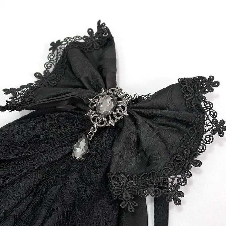 The fabric used in the composition of this gothic bow tie is textured and it is bordered with fringed floral, mesh lace.It is embellished with a silver brooch with a glass diamond.It can be adjusted as preferred. Product Specifications:Style: GothicFabric: 100% Polyester Gothic Lace, Horn Headband, Gothic Rose, Ram Horns, Lace Bows, Floral Headbands, Gothic Outfits, Gothic Style, Goth Outfits