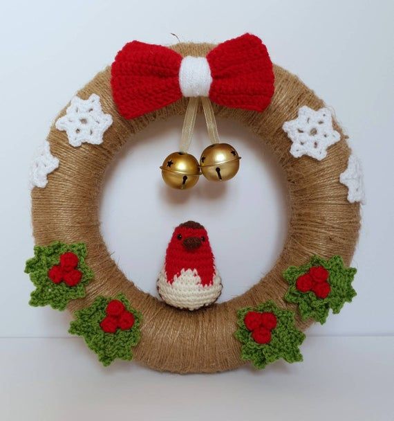 a christmas wreath with bells and decorations on it