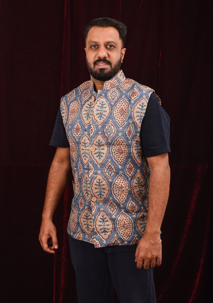 Introducing sophistication with a cultural twist, this Men's Blue Ghicha Silk Nehru Jacket exudes refinement and style. Crafted from luxurious Ghicha silk, the jacket features a striking Hand Ajrakh block print design that adds a touch of artistic flair. The classic mandarin collar elevates the ensemble with its silhouette, while the regular fit ensures comfort and ease of movement. Perfect for casualm semi formal and formal occasions , this Nehru jacket will make you stand out. It is a timeless Gentleman's Wardrobe, Nehru Jacket, Nehru Jackets, Tussar Silk Saree, Contemporary Fashion, Mandarin Collar, Salwar Kameez, Formal Occasion, Semi Formal