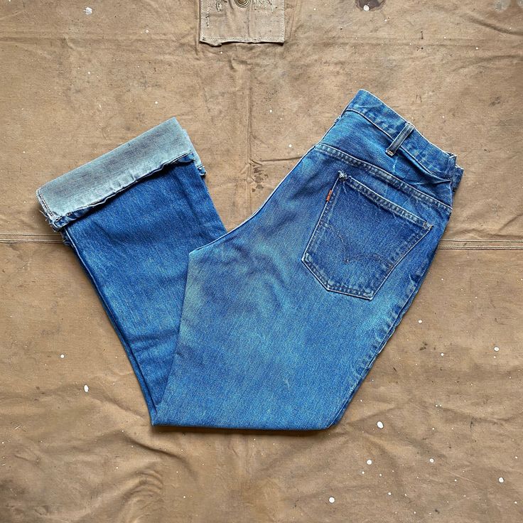 1960s / 70s Levi's jeans , single stitch, talon zipper , 1 Stamp Button. Looks like the waist has been taken in . Good condition. Please see photos Brand: Levis Size: about 32 x 34 - please see measurements below Waist: 16 inches Length: 42 inches Inseam : 31 inches Thigh: 21 inches Front rise - 13 inches Leg opening: 10 inches Vintage Medium Wash Jeans With Standard Cut Leg, Vintage Medium Wash Jeans Standard Cut, Vintage Medium Wash Standard Cut Jeans, Vintage Medium Wash Jeans, Retro Selvedge Rigid Denim Jeans, Vintage Wide Leg Rigid Denim Jeans, Retro Selvedge Denim Jeans, Vintage Selvedge Cotton Bottoms, Vintage Rigid Denim Flare Jeans In Denim Blue