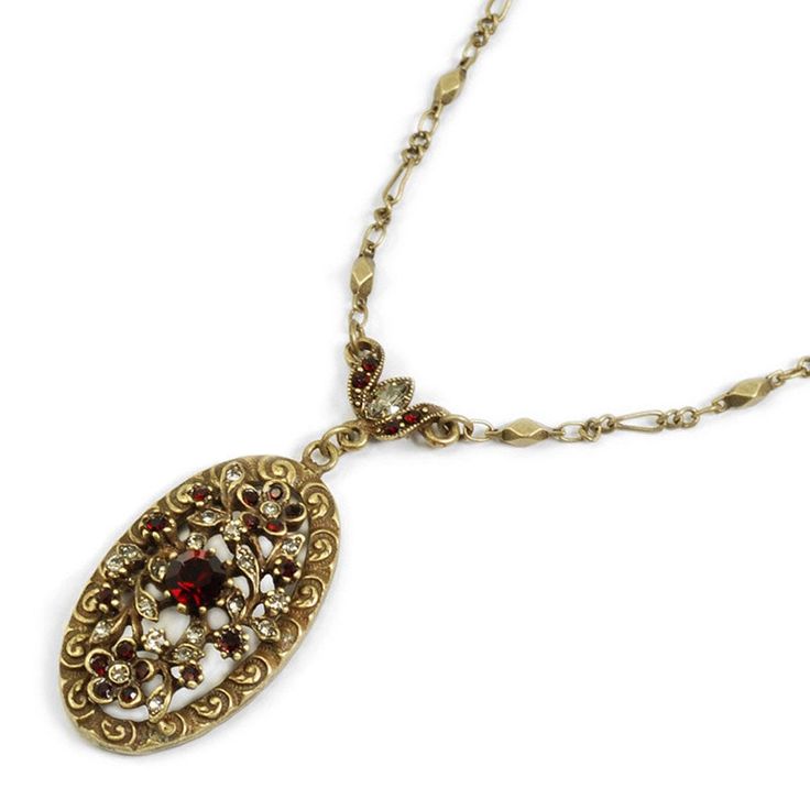 "An exquisitely sculptured floral motif. Round cut crystal in garnet and smoke color are positioned in graceful settings. A faceted Czech garnet stone rests in the center. Metal finish is burnished bronze. . Size: 19\" long + 2\" extender, Pendant: 1.5\" long by 1\" wide Made in our Los Angeles studio. To view matching earrings: htt ps://www.etsy.com/listing/238065166 To purchase as a set with the earrings: https://www.etsy.com/listing/658221407 Coordinating ring: https://www.etsy.com/listing/23 Victorian Jeweled Necklaces For Formal Occasions, Antique Ruby Necklace For Formal Occasions, Ornate Jeweled Necklaces For Formal Occasions, Antique Crystal Necklace For Formal Occasions, Victorian Garnet Necklace, Victorian Ruby Necklace For Formal Occasions, Antique Jeweled Necklace For Wedding, Antique Jeweled Necklaces For Wedding, Vintage Ruby Necklace For Formal Occasions