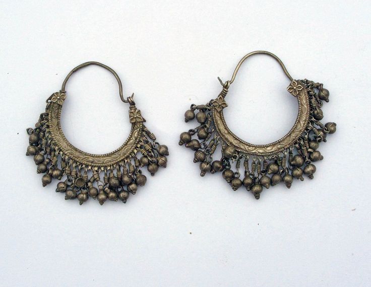 A pair of vintage silver earrings from Himachal Pradesh, India Silver 37,4 grams; 7 cm high  19/20th century This is only a part of my collection, for more items please visit my website  www.m-beste.com There you will find a large selection of jewelry, figurines, textiles and other objects from India and Tibet. * * * Shipping  * * * All international shipping is free and TRACKED. The jewelry will be sent carefully wrapped and packed. * * *  International Customers  * * * Customs, Duty Tax, VAT a Vintage Ceremonial Earrings With Intricate Design, Ceremonial Vintage Earrings With Intricate Design, Antique Ceremonial Earrings, Vintage Round Hoop Earrings With Intricate Design, Antique Ceremonial Dangle Earrings, Antique Dangle Earrings For Ceremonies, Antique Ceremonial Earrings For Pierced Ears, Vintage Brass Earrings With Engraving, Vintage Brass Earrings For Ceremonial Occasions