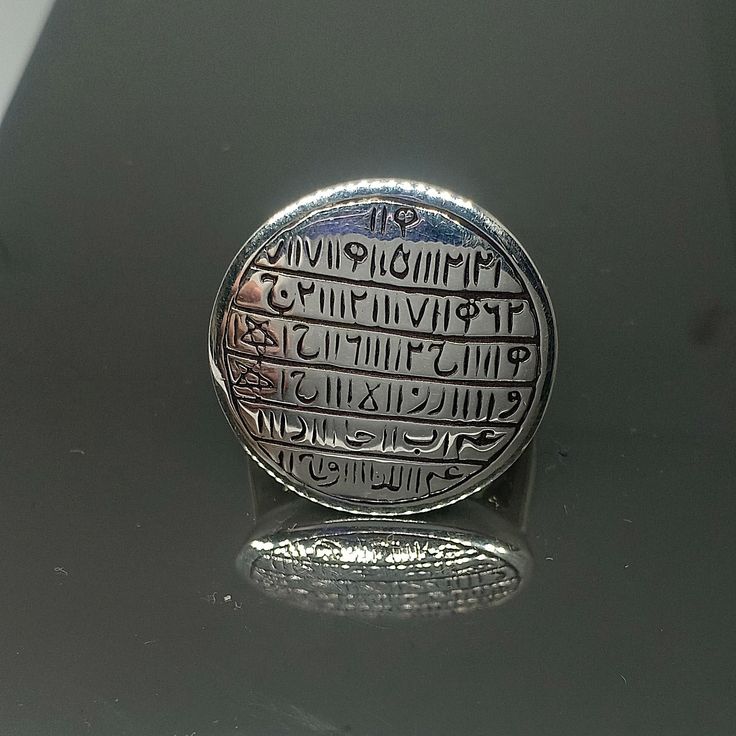 This sterling silver ring had engraved an ancient talisman, it is a very special and strong talisman. I collected this talisman text from a religion talisman master. After the talisman ring had engraved with carefully, he re-checked the ring and confirmed the engraving is perfect. This talisman is a talisman in the time of Khalifa Haroon Rasheed. It is very rare taweez talisman. This talisman is one of the rarest talisman that you have ever seen. The engraving is very clear and accurate. This ta Spiritual Anniversary Engraved Ring, Symbolic Ceremonial Engraved Rings, Symbolic Engraved Rings For Ceremonial Occasion, Antique Coin-shape Engraved Signet Ring, Antique Coin Shaped Engraved Signet Ring, Antique Engraved Coin Signet Ring, Symbolic Carved Round Ring, Symbolic Carved Ring, Ancient Style Silver Ring For Gift