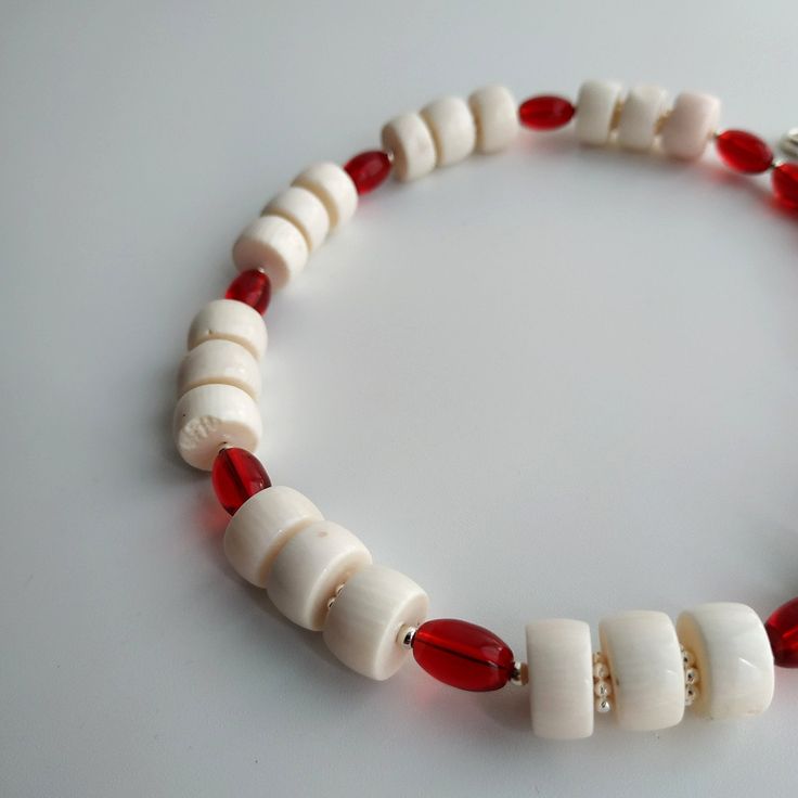 < One strand white coral and glass beaded necklace> The coral is natural, from the bottom of the Pacific Ocean. The clasp is made from metal. > Necklace length - 38 cm (14,9 in) > Necklace weight - 41 grams White Glass Necklace With Colorful Beads, White Bohemian Necklace In Glass, White Bohemian Glass Necklace, Bohemian White Glass Necklace, White Glass Beaded Necklace With Large Beads, White Glass Beaded Necklace For Beach, White Glass Beaded Necklaces For The Beach, White Glass Necklaces For Beach, White Glass Beaded Necklaces For Gifts