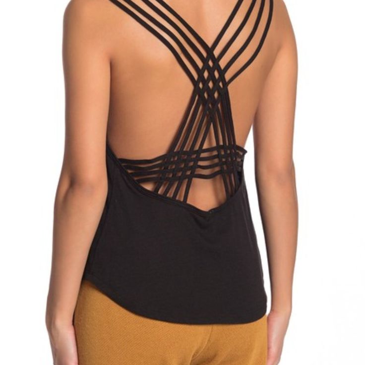 A Strappy Racerback Looks Ultra-Chic On This Sleeveless Valentine Casual Tank Top. - Crew Neck - Sleeveless - Strappy Racerback - Ribbed Trim - Knit Construction Shell: 50% Polyester, 25% Rayon, 25% Cotton Rib: 55% Cotton, 35% Polyester, 10% Rayon Casual Tank Top With Built-in Bra And Strappy Back, Strappy Gym Tops With Built-in Bra, Chic Workout Tank Top With Built-in Bra, Tops With Tie And Cross Back For Night Out, Tie Back Cross Back Top For Night Out, Black Top With Built-in Bra And Strappy Back, Black Tops With Built-in Bra And Strappy Back, Casual Cross Back Tank Top With Built-in Bra, Sleeveless Tie Back Tank Top For Night Out