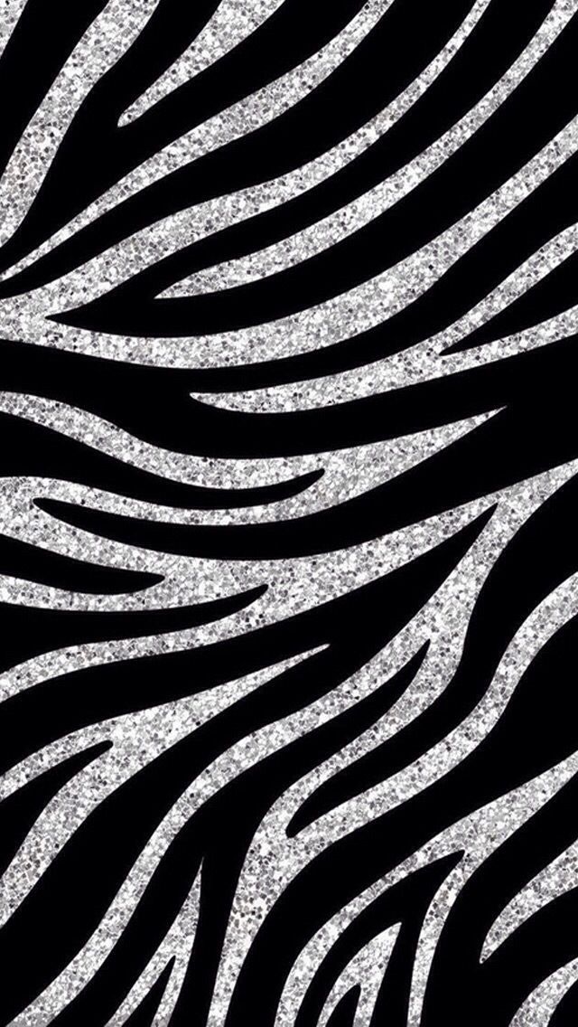 a black and white zebra print with silver glitter