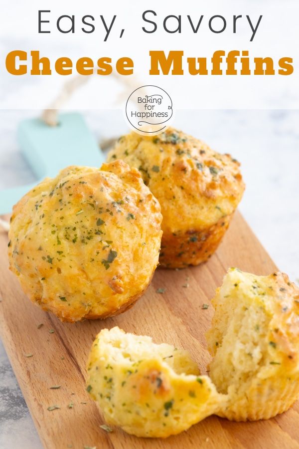 two cheesy muffins on a cutting board with the words easy savory cheese muffins