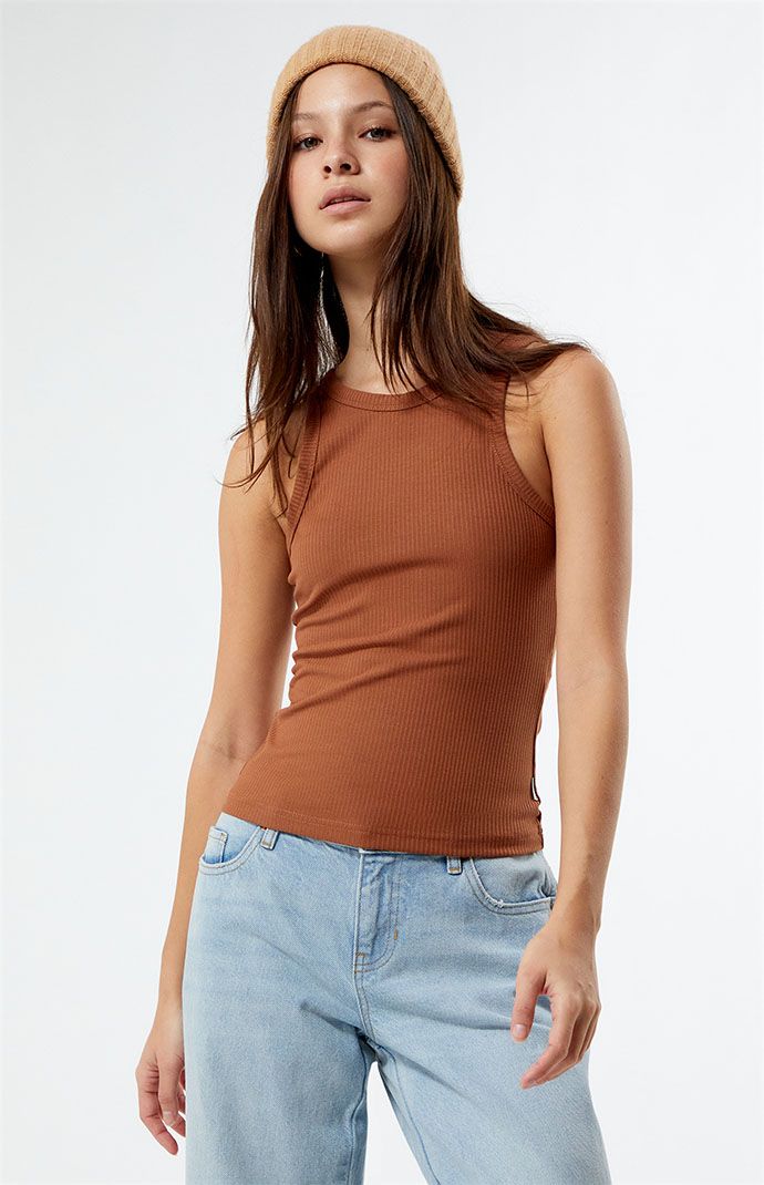 The Classic Tank Top from Rhythm makes for the perfect staple piece for your casual style. This ribbed tank has fixed straps, a scoop neckline, and a fitted design. 


	Solid color tank top
	Ribbed fabric
	Scoop neckline
	Fixed straps
	Regular fit
	Fitted
	60% polyester, 32% rayon, 8% spandex
	Hand wash
	Model is wearing a size small Crop Top Outfits, Ribbed Tank, Shorts Jeans, Staple Pieces, Ribbed Fabric, Scoop Neckline, Casual Style, Levi Jeans, Tank Top