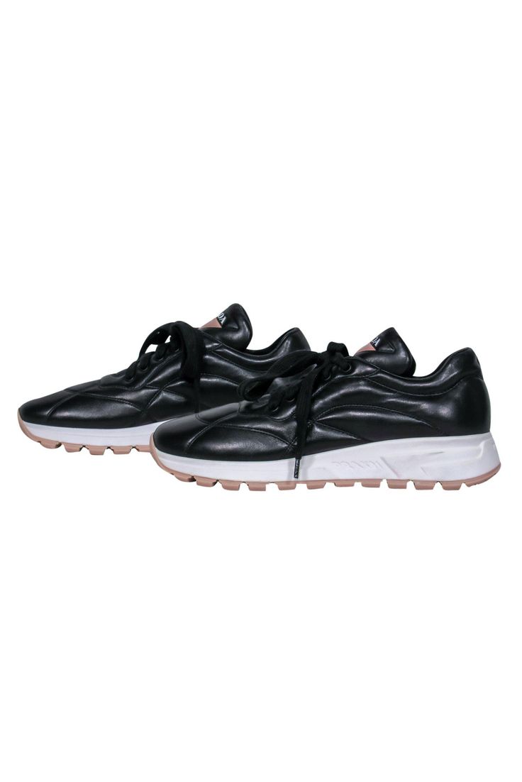 Get on board with the dad sneaker trend with these bad boys from Prada! Made with sleek leather and a chunky platform, these standout sneakers are perfect for any fashionista with serious street style. Super on-trend and will look great on your Instagram! Pair with a colorful tracksuit for an athleisure-inspired look that's sure to get tons of “likes”! Size 9.5 (EU 39.5) Leather upper Lace-up closure Round toe White and pink platform Leather sole and footbed w/ no wear Original dustbag included Black Chunky Sneakers With Contrast Sole For Streetwear, Black Leather Chunky Sneakers With Boost Midsole, Sporty Chunky Sneakers With Lug Sole For Streetwear, Black Chunky Sneakers For Streetwear With Textured Sole, Leather Sneakers With Lug Sole For Sports, Leather Sneakers With Lug Sole, Black Leather Chunky Sneakers With Contrast Sole, Sporty Chunky Sneakers With Contrast Sole For Streetwear, Urban Black Chunky Sneakers With Abzorb Midsole