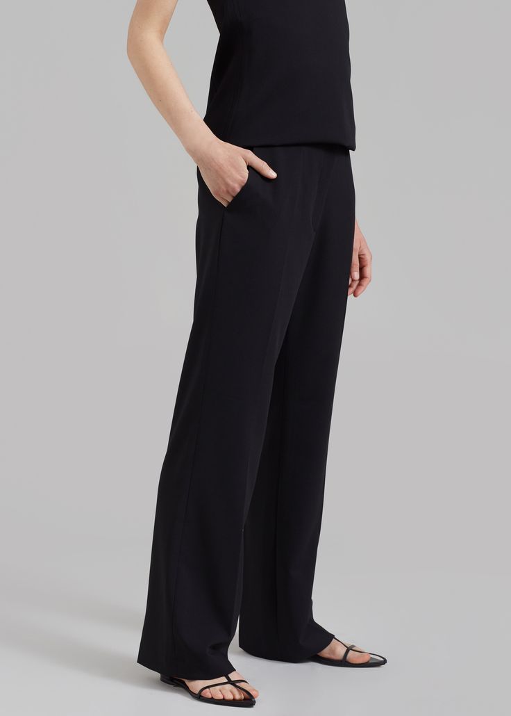 Color: Black Midweight suiting fabric Relaxed fit Straight leg Mid rise Pressed crease detail Slant hip pockets Illusion welt back pockets Belt loops Hook and bar closure Zip fly 64% Polyester 30% Rayon 6% Spandex Dry Clean By The Frankie Shop. Imported Pocket Belt, Mid Rise, Straight Leg, Trousers, Relaxed Fit, Black