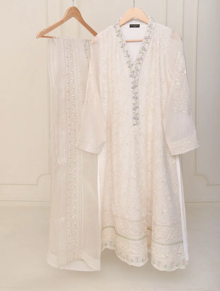 "Two piece pure cotton net shirt with dupatta  length: 47\" dupatta fabric: organza" Party Sharara In Organza With Naqshi Detailing, Organza Sharara With Naqshi For Party, Party Sharara With Naqshi In Organza, Unstitched Chanderi Kurta With Dabka Work, Elegant Cambric Sharara With Zari Work, Cotton Sharara With Sheer Dupatta For Eid, Cotton Sharara With Sheer Dupatta For Wedding, Organza Sharara With Naqshi For Diwali, Party Organza Sets With Naqshi Detailing