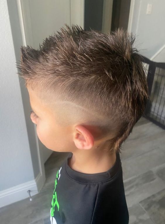 Top 18 Mohawk Haircuts For Your Kids To Try In 2024 Boy Fohawk Haircut, Baseball Mohawk Hair, Kid Faux Hawk, Kids Mohawk Hairstyles, Boys Haircut Mohawk Mullet, Fohawk Haircut For Toddler Boys, Toddler Boy Faux Hawk, Mohawk Mullet Kids, Fade Mohawk Kids