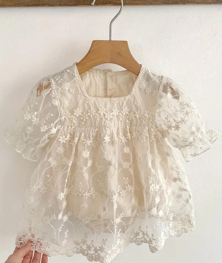 This beautiful dress is perfect for any occasion, whether it's a party, wedding, christening, or just a casual day out. The intricate flower embroidery and lace detailing add a touch of elegance and charm to the dress.  These dresses are MADE to ORDER. so please allow 3 weeks for arrival! The puff sleeves provide a comfortable fit for the baby and the tulle fabric gives the dress a playful and whimsical look. The dress is suitable for infants and toddlers aged 0-3, 3-6 or 6-9 months and comes in Elegant Spring Baptism Party Dress, Spring Tulle Lace Dress For Garden Party, Garden Party Tulle Dress With Lace Patchwork, Spring Garden Party Lace Dress In Tulle, Spring Garden Party Lace Dress With Tulle, Elegant Spring Floral Embroidered Lace, Elegant Spring Floral Embroidery Lace, Beige Lace Dress With Floral Embroidery, Embroidered Tulle Dress For Ceremonies