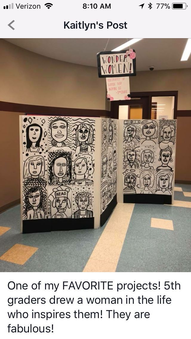 an office cubicle decorated with paper cut outs and drawings on the walls, along with a sign that reads'one of my favorite projects 5th grade students draw a woman in the life who inspires then they are fabulous