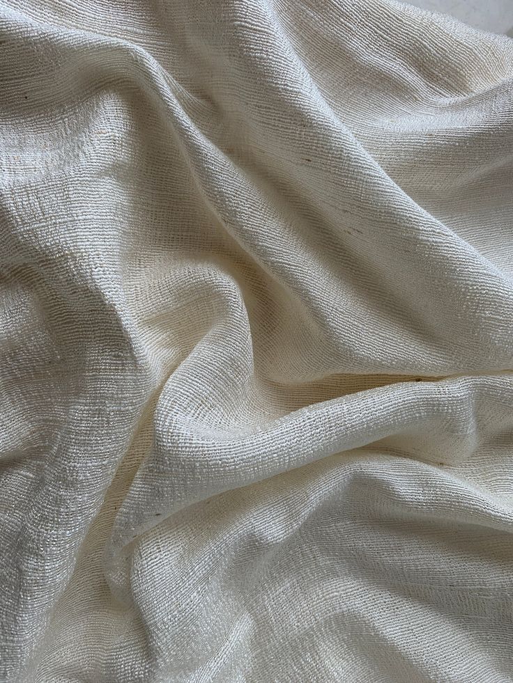 "Raw silk fabric , Vietnamese silk , raw silk make remove make up pad , natural raw silk , mulberry silk non dye. Message first if you're buying in bulk to the product description Fabric Size: 33,4\" (85 cm) 🌿If you buy quantity 1, you are buying 1 meter of fabric with a width of 33,4\". 🌿If you buy quantity 2, you are buying 1 piece of fabric 2 meters long, 33,4\" wide 🌿The same goes for more quantities. Materials: 🌿Weaving is done entirely by hand with 100% natural raw silk. Made from high Cocoon Silk, Eco Brand, Raw Silk Fabric, Makeup Remover Pads, Remove Makeup, Silk Fabrics, Reusable Pouches, Japanese Silk, Fabric Texture