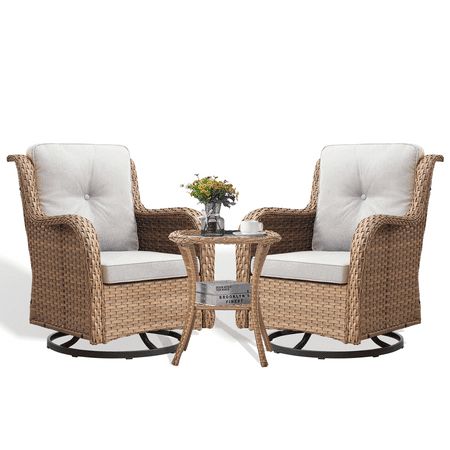 two wicker chairs with white cushions and a small table in front of each chair