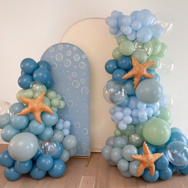 balloons and starfishs are arranged in the shape of letters