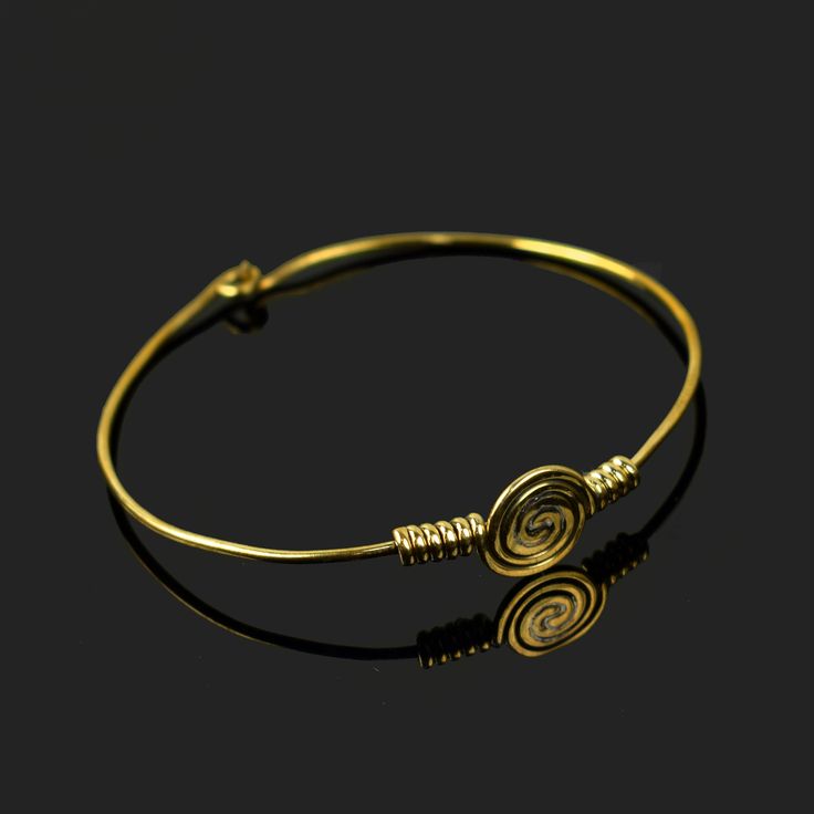 Handmade Hypnotized Infinity Circle Bracelet \ Cuff Bangle \ Open Bangle \ Wedding Bangle \ Boho Bracelet \ Decent Bangle \ Vintage Bangle [GFS3239] Bangle Size :  2.5 Inches ( L Size ) Can Adjust Little Bit Weight    : 8 gm Material  : Brass Polish   : All Polish Are Available . Contact us for wholesale prices. R I N G S https://www.etsy.com/in-en/shop/GemFormingStudio?section_id=22783374 B E A D S https://www.etsy.com/in-en/shop/GemFormingStudio?section_id=22828835 W A N D S https://www.etsy.com/in-en/shop/GemFormingStudio?section_id=22997040 C H A R M S https://www.etsy.com/in-en/shop/GemFormingStudio?section_id=23027116 B A N G E L S https://www.etsy.com/in-en/shop/GemFormingStudio?section_id=22816494 P E N D A N T S https://www.etsy.com/in-en/shop/GemFormingStudio?section_id=22774914 Adjustable Spiral Wire Wrapped Bracelets, Gold Spiral Wire Wrapped Bracelets, Infinity Metal Jewelry For Wedding, Adjustable Wire Wrapped Cuff Bracelet For Wedding, Hand Wrapped Bangle Jewelry For Wedding, Wedding Wire Wrapped Cuff Bracelet, Wedding Bangle Jewelry Hand Wrapped, Wedding Hand-wrapped Bangle Jewelry, Wedding Hand Wrapped Bangle Jewelry