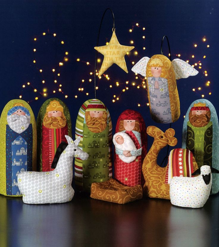 a group of nativity figurines sitting on top of a table