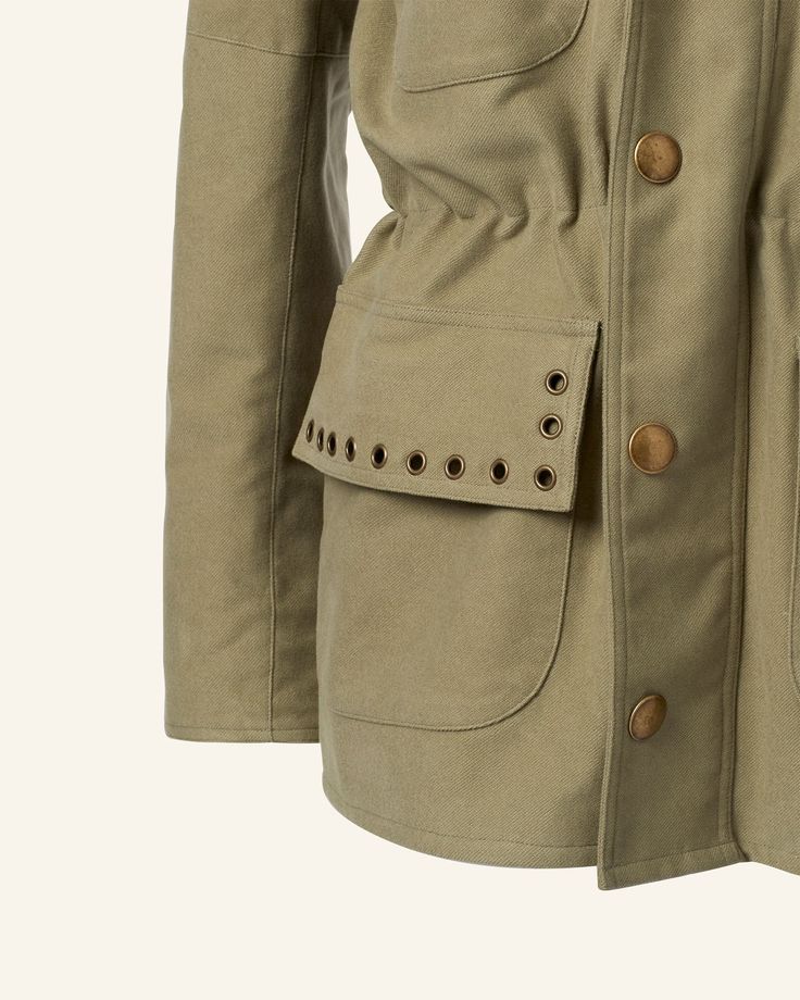 Crafted in Japanese brushed cotton, our army green utility jacket is embellished with brass rivets and snaps. Lined in a polka-dot print tencel, the jacket has multiple pockets and an interior drawstring for cinching. An everyday workhorse jacket. Winter Khaki Utility Jacket With Button Closure, Winter Utility Jacket With Snap Buttons In Khaki, Winter Khaki Utility Jacket With Snap Buttons, Olive Fall Utility Jacket With Multiple Pockets, Olive Utility Jacket With Multiple Pockets For Fall, Military Style Cotton Utility Jacket With Buttoned Pockets, Khaki Workwear Parka With Patch Pockets, Khaki Workwear Parka With Multiple Pockets, Military Utility Jacket With Buttoned Pockets For Fall