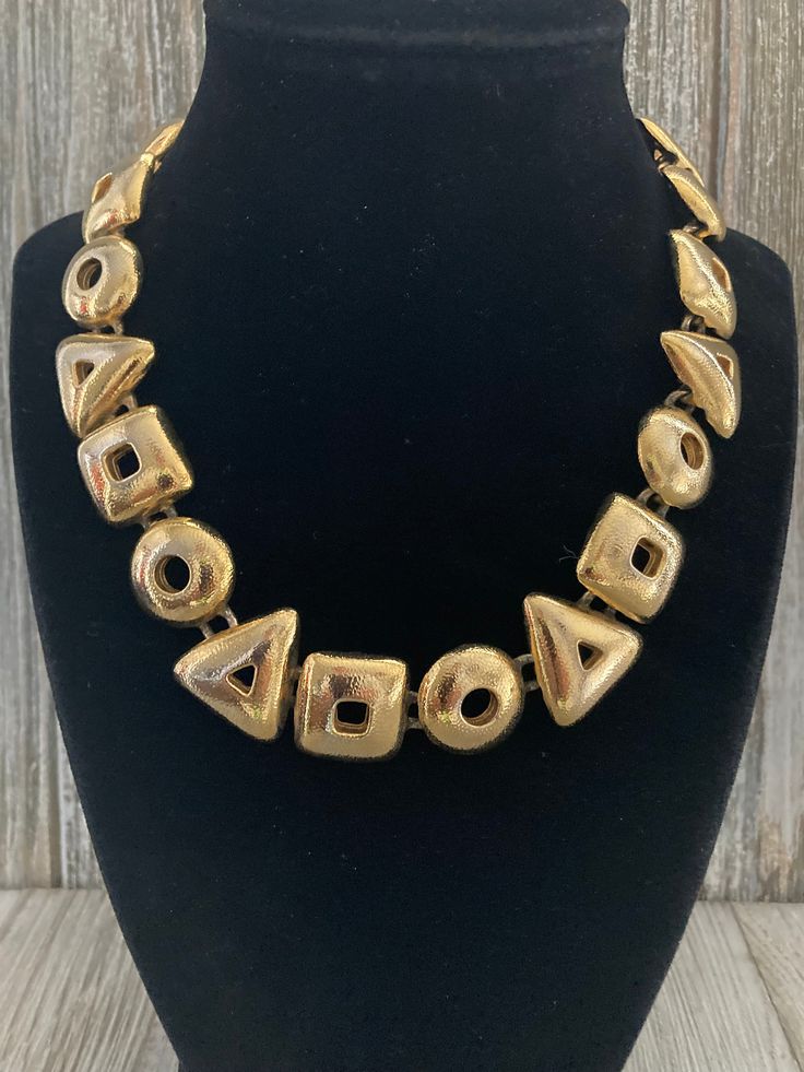 "Fabulous Vintage ANNE KLEIN Signed Gold Modern Runway Collar Necklace Circa 1990's Excellent condition...front is perfect....back has minor wear Signed Anne Klein Very high quality Textured gold finish Modern design Couture look Adjustable toggle closue 17\" overall length, 1\" wide" Retro Adjustable Gold Necklace, Adjustable Retro Gold Necklace, Retro Gold Metal Necklace, Retro Gold-tone Metal Necklace, Retro Gold Choker Necklace, Gold Runway, Gaudy Jewelry, Single Necklace, Couture Looks