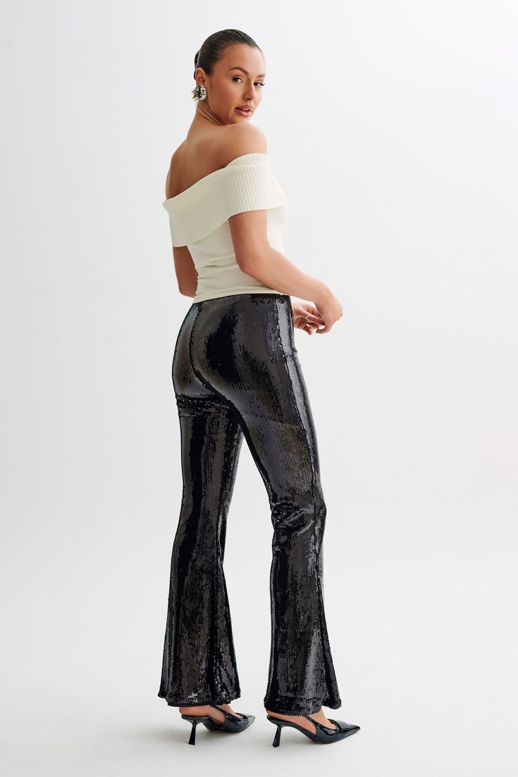 Zero disco ball required.The WILMA are a pair of sparkling wide-legged pants with a high waistline and flared hems. An invisible zipper closure at the side seam gives it a sleek, seamless silhouette. The legs transition into a flattering bootcut that complements its high, fitted waist. Lined sequinned fabrication adds a touch of comfortable glam, making these pants the perfect choice for all-night wear. Chic Evening Flares Trousers, Chic Wide-leg Evening Flares, Elegant Flares For Night Out, Chic Evening Wide-leg Flares, Chic Evening Flares, Trendy High Waist Flares For Night Out, Trendy High-waist Flares For Night Out, Glamorous Fitted Wide Leg Pants For Evening, Fall Party High Waist Wide Leg Pants