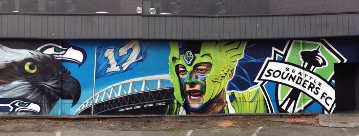 the mural on the side of a building depicts an eagle and two men's faces