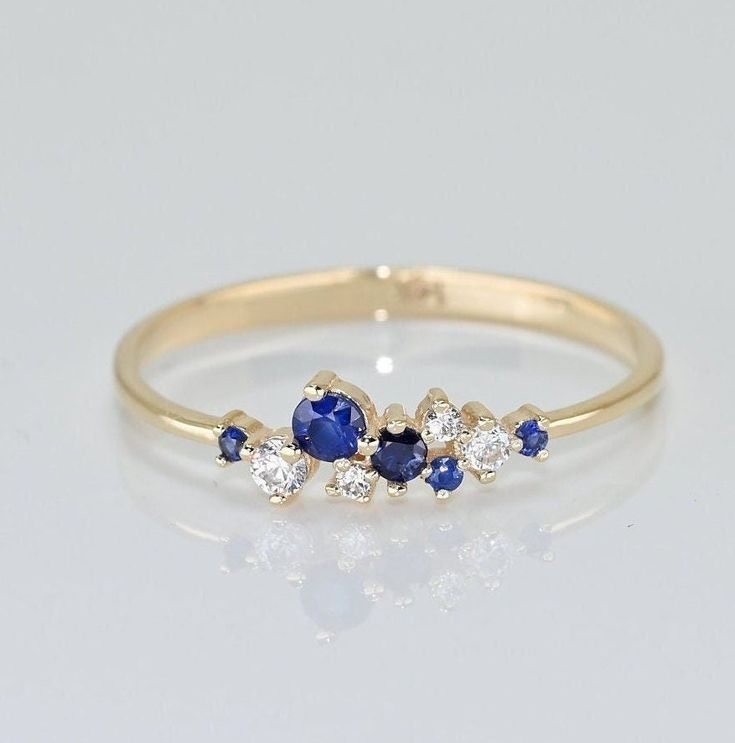 💙 14k Solid Gold Sapphire Cluster Ring. Dainty Sapphire Ring, Premium Fine Jewelry For Her. 💙 Our jewelry is handcrafted with love and great care at San Francisco Bay! 💙 You will receive them exactly as pictured. We don't use any filters, all photos are authentic and unedited. 💙 The ring material is 14k Solid Gold, should not be confused with gold plating or filling. It won't tarnish or fade over time. 💎 Gemstones are Natural Sapphire and moissanite as a conflict-free and environmentally fr Sapphire And Diamond Cluster Ring, Sapphire Cluster Ring In 14k Gold As Gift, Tiny Sapphire Ring, 14k Gold Cluster Ring For A Gift, 14k Gold Cluster Rings For Gifts, Yellow Gold Sapphire Cluster Ring As Gift, Heirloom Cluster Jewelry For Gifts, 14k Gold Cluster Ring Gift, 14k Gold Sapphire Jewelry For Anniversary