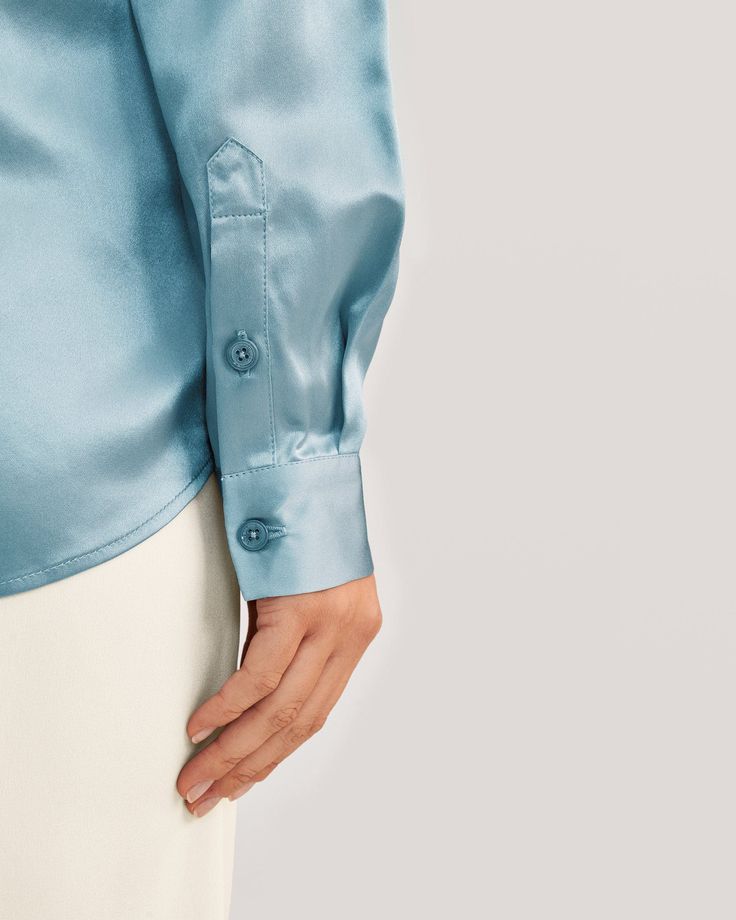 A timeless classic made from the finest Charmeuse silk, which gives this easy-to-care-for shirt a beautifully soft luster. Whether teamed with a suit or jeans, the neat collar and concealed mother-of-pearl buttons create a well-groomed look. 22 Momme Charmeuse Silk Glossy Smooth Soft Luxury Silk Button-up Tops, Elegant Silk Button-up Top, Elegant Silk Shirt For Daywear, Classic Silk Tops, Luxury Silk Top With Button Closure, Elegant Silk Top With Hidden Button Closure, Luxury Silk Tops With Button Closure, Elegant Silk Tops With Hidden Button Closure, Sleek Silk Button-up Top