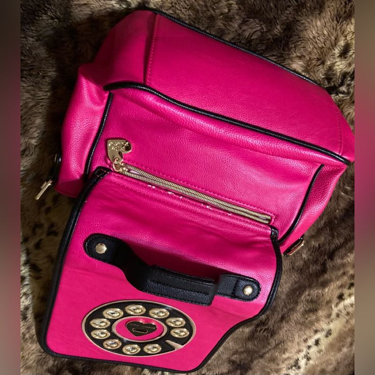 Gorgeous Betsey Johnson Telephone Pocketbook With Attached Adjustable Strap, 2 Inside Pockets & Zipper Compartment. Brand New***Without Tags! Approx. L” Is 8” Across, H Is 9”(Not Counting Straps), 4.5 Diameter Inside. From Nonsmoking Home. ***Backside Has Some Pink Trim Coming Undone Above The Outside Zipper. Unique Pocketbook From Betsey Johnson Is Vintage-No Tags-Never Used! Trendy Pink Satchel With Mobile Phone Bag, Trendy Pink Satchel With Phone Bag, Chic Pink Satchel For School, Chic Pink School Satchel, Pink Mobile Phone Shoulder Bag For School, Chic Pink Mobile Phone Bag, Pink School Satchel With Mobile Phone Bag, Pink Satchel With Mobile Phone Bag For Travel, Pink Satchel Shoulder Bag For Mobile Phone