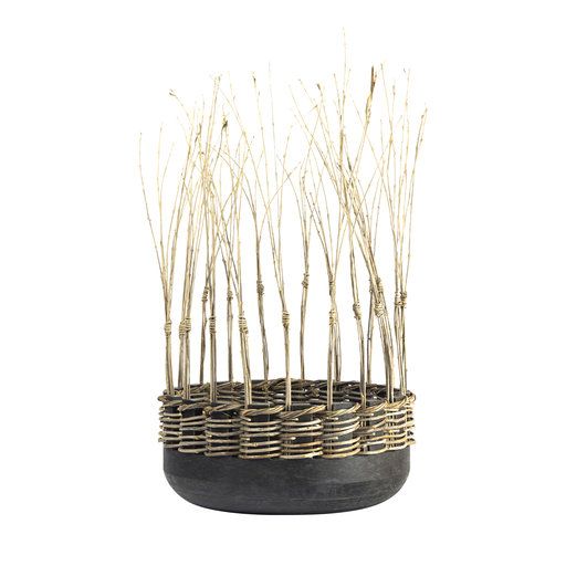 a planter with branches in it on a white background