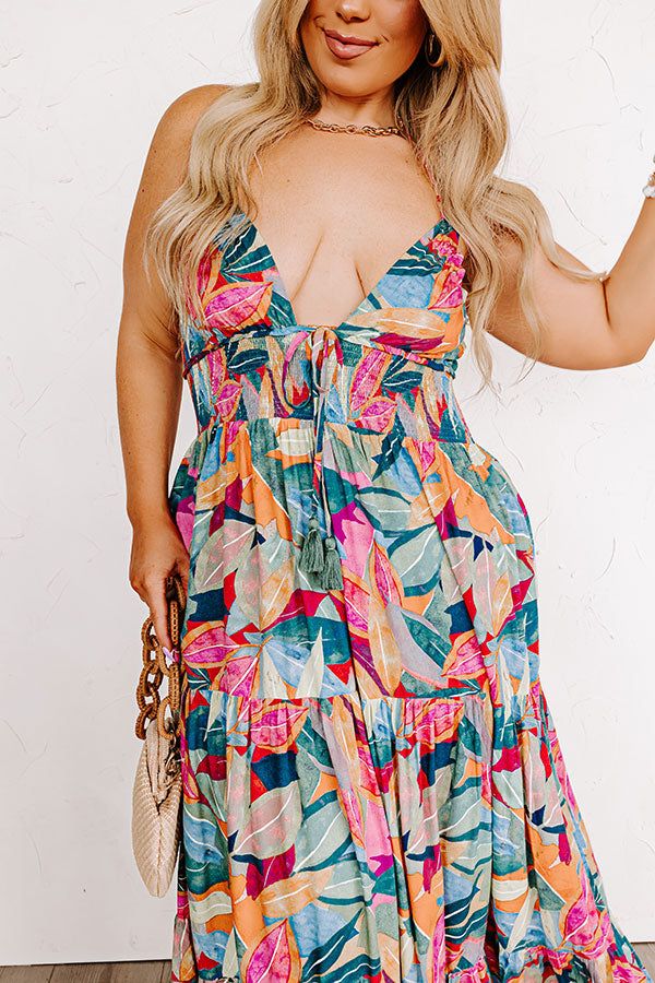 - Grab an umbrella drink and step into tropical style with this beautiful maxi! - Unlined lightweight material with a colorful abstract botanical print -A deep-v neckline featuring a tie detail with accent tassels - Halter tie closure with accent tassels - An open back - A smocked lower bodice - Hidden side pockets - A flowy yet flattering silhouette that ends in a straight ankle length hemline Tropical V-neck Maxi Dress With Vibrant Print, Vibrant Green V-neck Maxi Dress, Vibrant Green Tropical Print Maxi Dress, Tropical V-neck Dress In Multicolor Print, Tropical V-neck Multicolor Print Dress, Tropical V-neck Dress With Multicolor Print, Green Abstract Print Maxi Dress For Beach, Green Maxi Dress With Abstract Print For Beach, Green Abstract Print Maxi Dress For Vacation