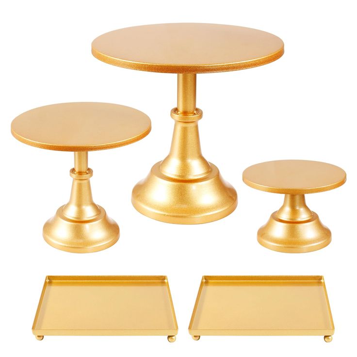 three gold pedestals and one round table with two trays on each side, all in the same color