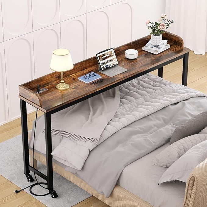 a bed sitting under a wooden table on top of a hard wood floor