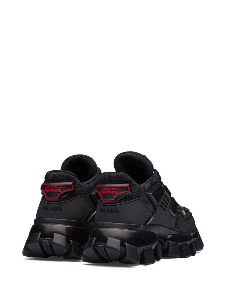 Prada Cloudbust Thunder Sneakers | Farfetch.com Designer Black Sneakers With Translucent Outsole, Luxury Black Sneakers For Sports, Luxury Black Sports Sneakers, Luxury Black High-top Sneakers For Sports, Black Nylon Sneakers With Abzorb Midsole, Modern Black Nylon Sneakers, Black Nylon High-top Sneakers With Vibram Sole, Black Nylon High-top Sneakers For Streetwear, Black Nylon Sneakers For Streetwear