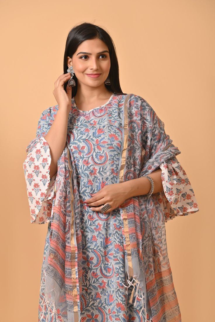 Crafted with the finest Indian cotton, this exquisite dress is a celebration of traditional craftsmanship and contemporary style. Each intricate block print design is a testament to the rich heritage of Indian textiles, specifically hailing from the colorful region of Rajasthan. The lightweight and breathable cotton fabric make this dress a perfect choice for warm summer days, ensuring both comfort and style in one elegant piece. The Jaipuri print adorning the dress brings alive the vibrant colors and floral patterns that are characteristic of this culturally rich region. This stunning cotton dress is more than just clothing; it's a statement piece that bridges the gap between tradition and modern fashion. Whether you're looking for a standout ensemble to gift your girlfriend, mom, sister, Traditional Anarkali Set With Kalamkari Print, Bollywood Style Cotton Lawn Suit With Printed Border, Bollywood Style Cotton Sharara With Block Print, Cotton Block Print Palazzo Set For Festivals, Cotton Block Print Sharara For Festivals, Festival Cotton Sharara With Block Print, Cotton Sharara With Block Print For Festivals, Cotton Palazzo Set With Printed Border For Diwali, Cotton Kurta With Printed Border For Diwali