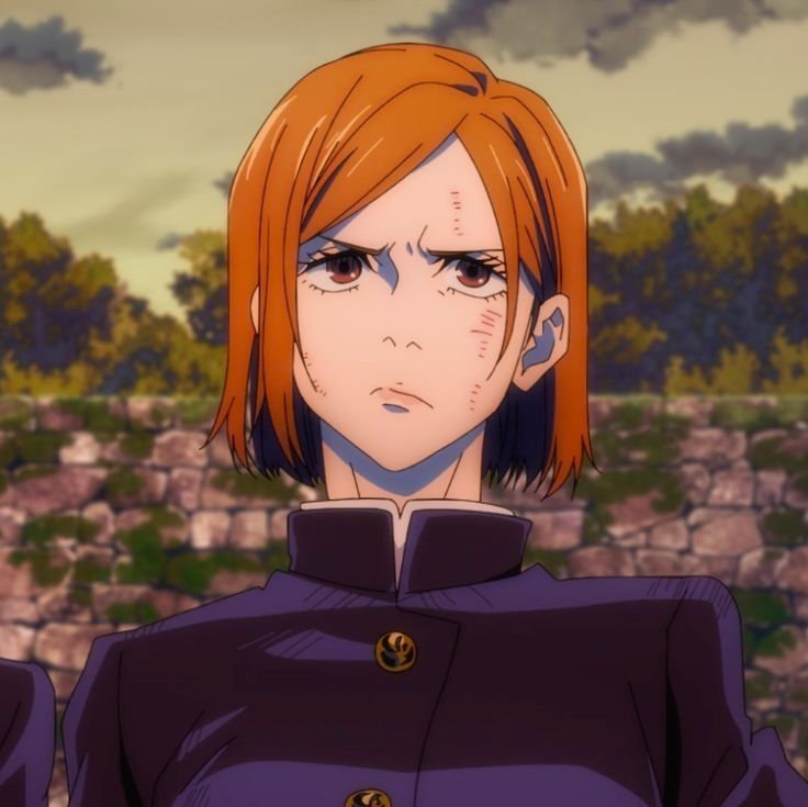 an anime character with red hair and blue eyes looks at the camera while standing in front of a stone wall