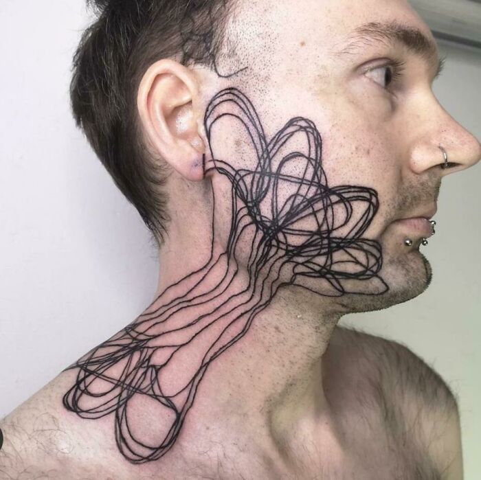 a man's neck is covered with wires