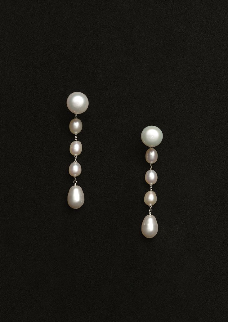 Sophie Buhai drop earrings with freshwater pearls and crystal pearl at the end in sterling silver. Features a see-through post closure.
Sold as a pair. Each earring measures 2.25in length. Weight: 4.1g.
Color: White Pearl. Sterling Silver, White Pearl. Handcrafted in Los Angeles.
SS24SB011 Classic White Drop Linear Earrings, Formal Pearl Drop Linear Earrings, White Drop Linear Earrings For Formal Occasions, Pearl White Long Drop Jewelry For Formal Occasions, Formal White Drop Linear Earrings, Formal Long Drop Pearl White Jewelry, Formal Sterling Silver Linear Pearl Drop Earrings, Sophie Bille Brahe, Sophie Buhai