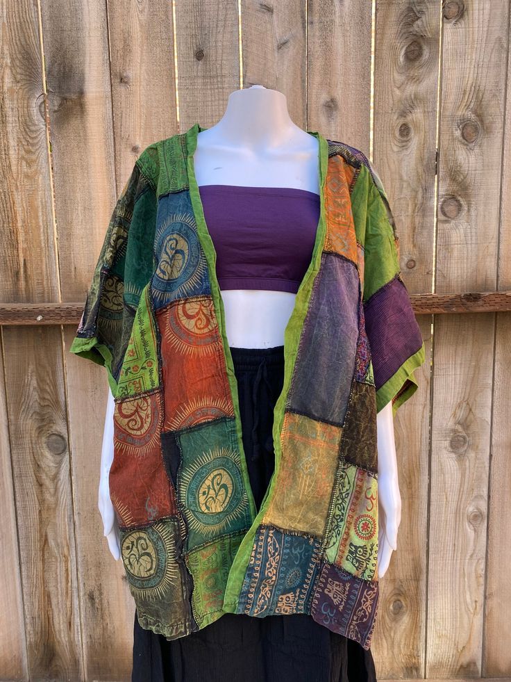 Patchwork Cardigan / Coverup / Kimono This top is fully made of patches with outer side lining Stone washed for color Open front Short sleeve One size Fits S - XXL This is a great piece as a cover up and can act as a shirt on top of a tank top Each item is unique - you can message for front / side / back pictures since not all are included I want to say this can also be worn reversible as there is only two side seams present on the inside (it is meant to have lining on the outside) Please messag Bohemian Tops With Patchwork For Layering, Bohemian Tops With Patchwork, Casual Multicolor Patchwork Kimono, Bohemian Patchwork Cardigan For Summer, Festival Kimono With Green Patchwork, Festival Green Kimono With Patchwork, Casual Green Cotton Patterns, Green Bohemian Top For Layering, Green Bohemian Cardigan For Festival