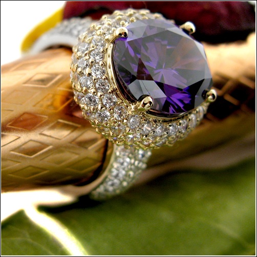 One of a kind exquisite ring set with AAA high quality oval amethyst color center stone in prong setting in 18K yellow gold top, domed band is covered with small pave set stones in platinum  StoneSize:  5ct. center 2ct. sides TCW 7 Stone Shape:  Oval/Round Metal:  18K Gold & Platinum Two Tone Luxury Macy's Ring With Center Stone, Luxury Concave Gemstone Rings, Luxury High Luster Oval Gemstones, Luxury Aaa Quality Women's Rings, Luxury Amethyst Ring With 17 Jewels And Oval Shape, Luxury Amethyst Ring With Diamond Accents And Cubic Zirconia, Luxury Oval Amethyst Ring With 17 Jewels, Luxury Oval Crystal Ring With Large Stone, Luxury Oval Purple Diamond Ring