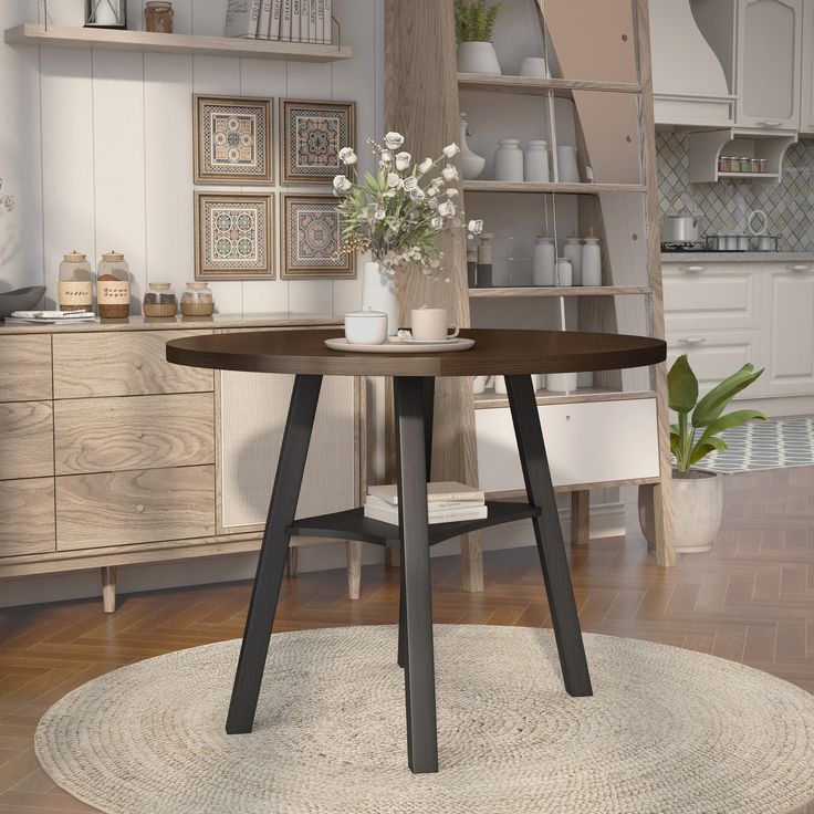 a round table with some flowers on it in the middle of a living room area