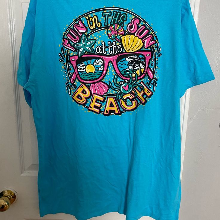 Brand New*** Blue Tshirt Summer Beach Size Xl Casual Blue T-shirt For Beach Party, Fun Light Blue Crew Neck T-shirt, Light Blue Relaxed Fit Beach Top, Blue Summer T-shirt For Vacation, Blue Short Sleeve T-shirt For Beach Season, Blue Short Sleeve T-shirt For Beach, Blue Cotton T-shirt For Beach Season, Blue Short Sleeve Summer T-shirt, Blue Cotton T-shirt For Summer